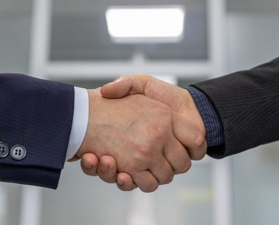 Two business partners shaking hands